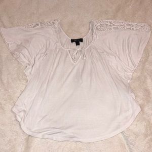 White blouse with white embroidery on sleeves